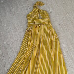 the clothing company Mustard and White Striped Halter Maxi Dress